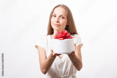 young woman holding white round gift box