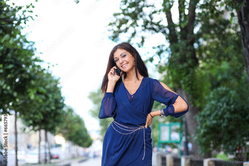 Happy woman talking on cell phone Happy woman talking on cell phone