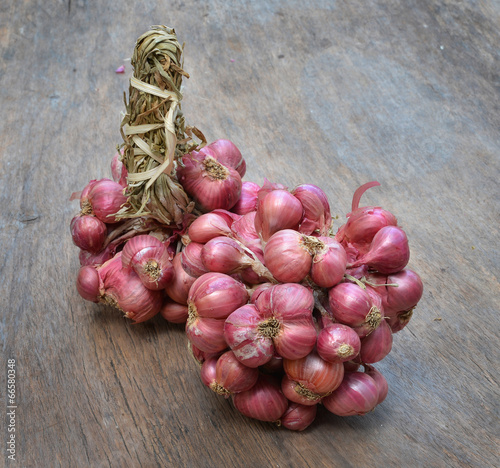 Shallot onions in a group on wood