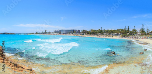 Fototapeta Naklejka Na Ścianę i Meble -  A view of a azzure water and Nissi beach in Aiya Napa, Cyprus