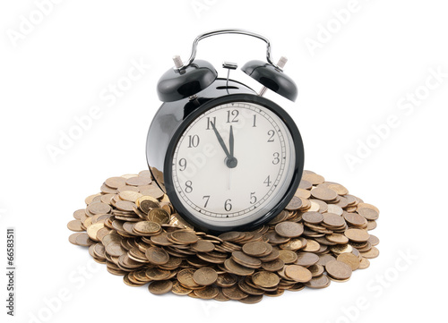 Time is money. Alarm clock with coins. Clipping path included.