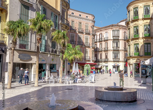 MALAGA - JUNE 12: City street view with cafeteria terraces and s