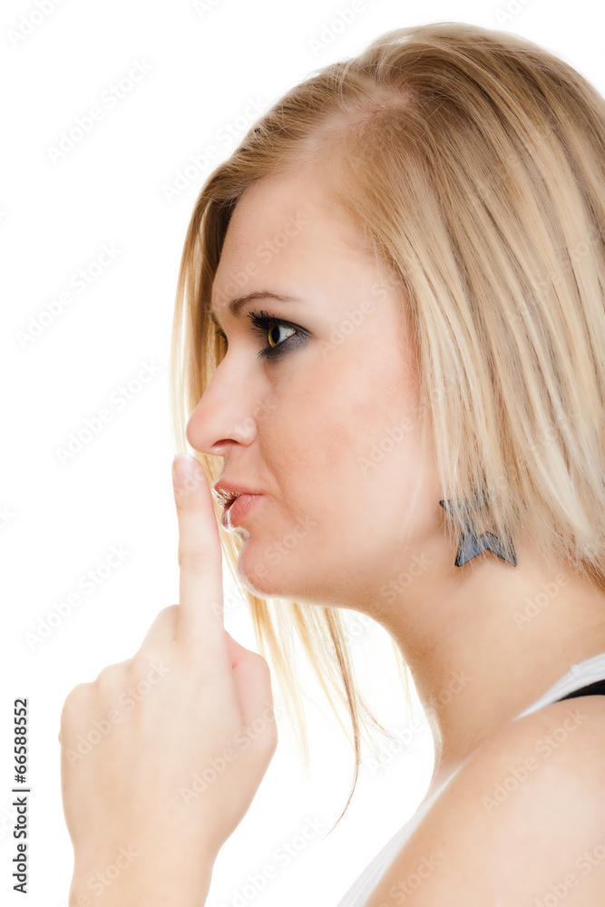 Blonde girl with finger on lips asking for silence Blonde girl with finger on lips asking for silence