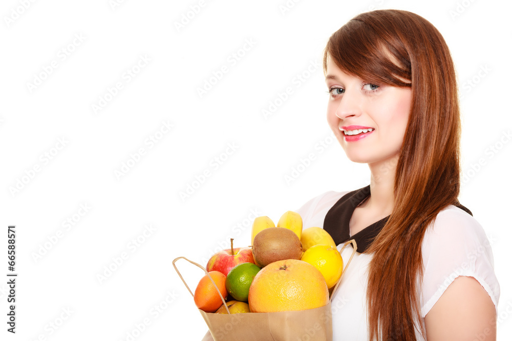 Grocery. Girl holding paper shopping bag with fruits Grocery. Girl holding paper shopping bag with fruits