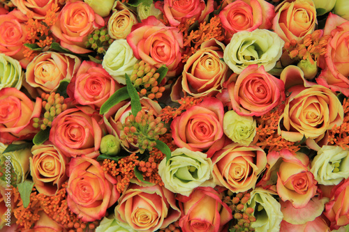 Fototapeta Naklejka Na Ścianę i Meble -  Orange and yellow roses in a bridal bouquet