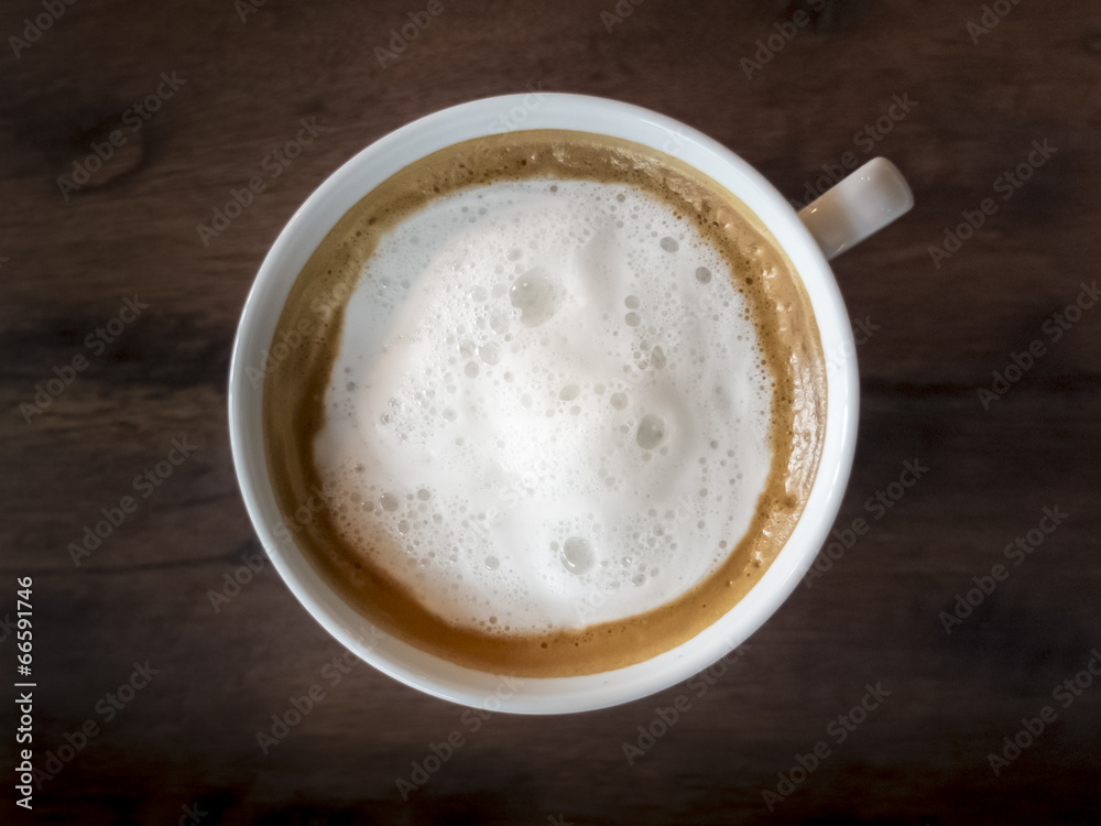 Cappuccino Coffee on wooden table background Cappuccino Coffee on wooden table background