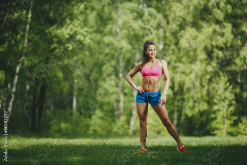 Fitness woman runner in park before running work out