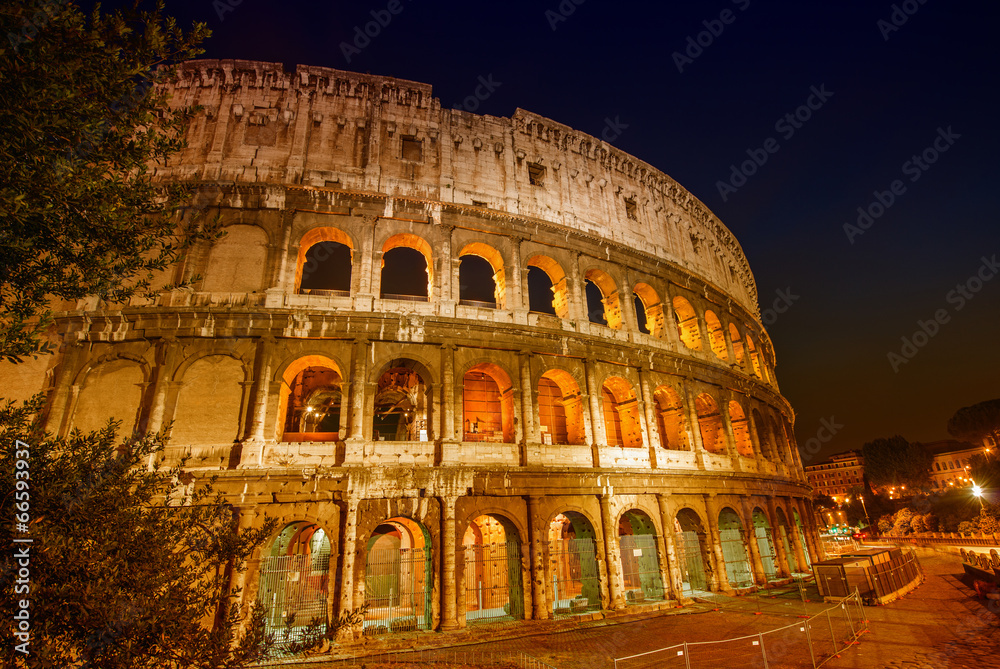 Stunning view of Colosseum at night, Rome - Italy