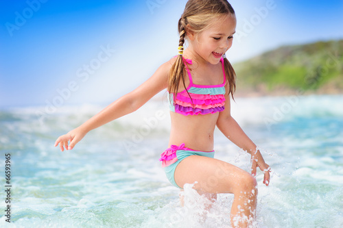 happyt child girl on a  tropical beach ocean