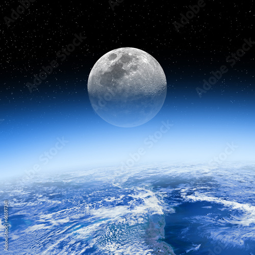 Fototapeta Naklejka Na Ścianę i Meble -  Moon behind the Earth's atmosphere. Small stars in background.