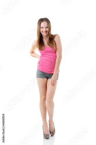 attractive happy teen girl in pink t-shirt, full length portrait