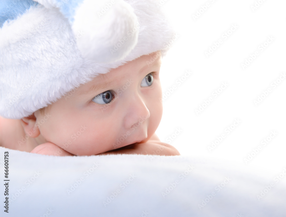 christmas cute baby boy lying on blue soft plaid like on snowdri christmas cute baby boy lying on blue soft plaid like on snowdri
