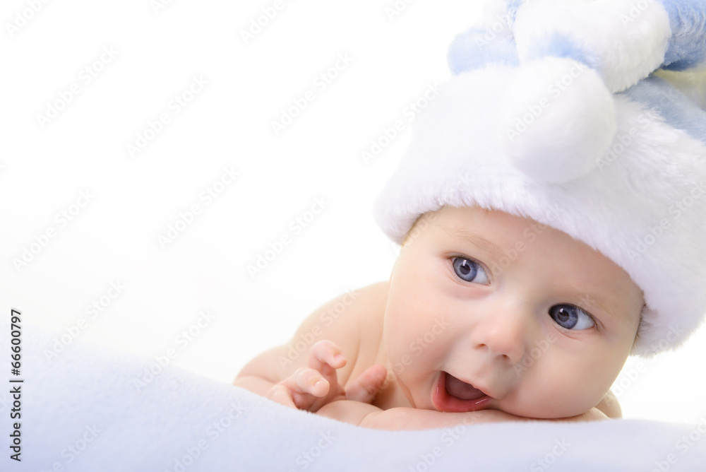christmas cute baby boy lying on blue soft plaid like on snowdri christmas cute baby boy lying on blue soft plaid like on snowdri