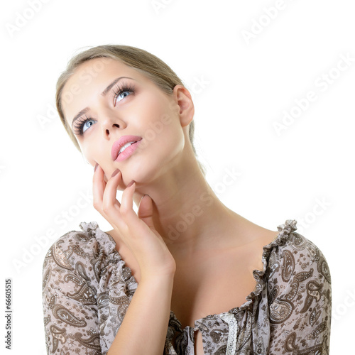 Close-up portrait of dreaming and planing girl looking up into t