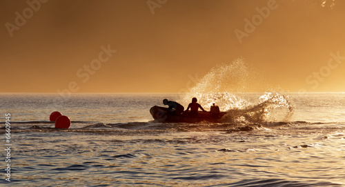 Members of the surf lifesaving club practice their boat drills 