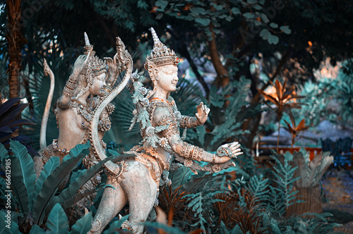 Statues in the garden of Erawan museum photo