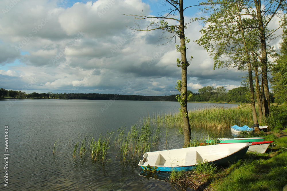 Small Boats on Shore of lake. Mazury. Poland Small Boats on Shore of lake. Mazury. Poland