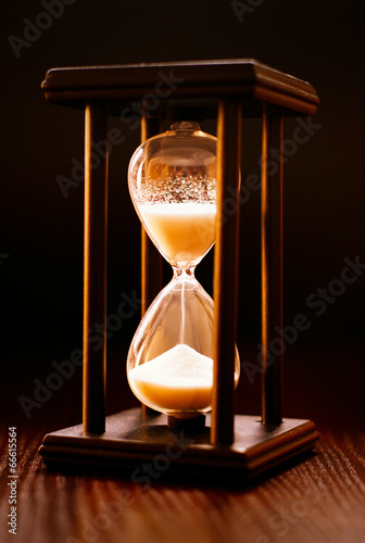 Illuminated hourglass in a wooden frame