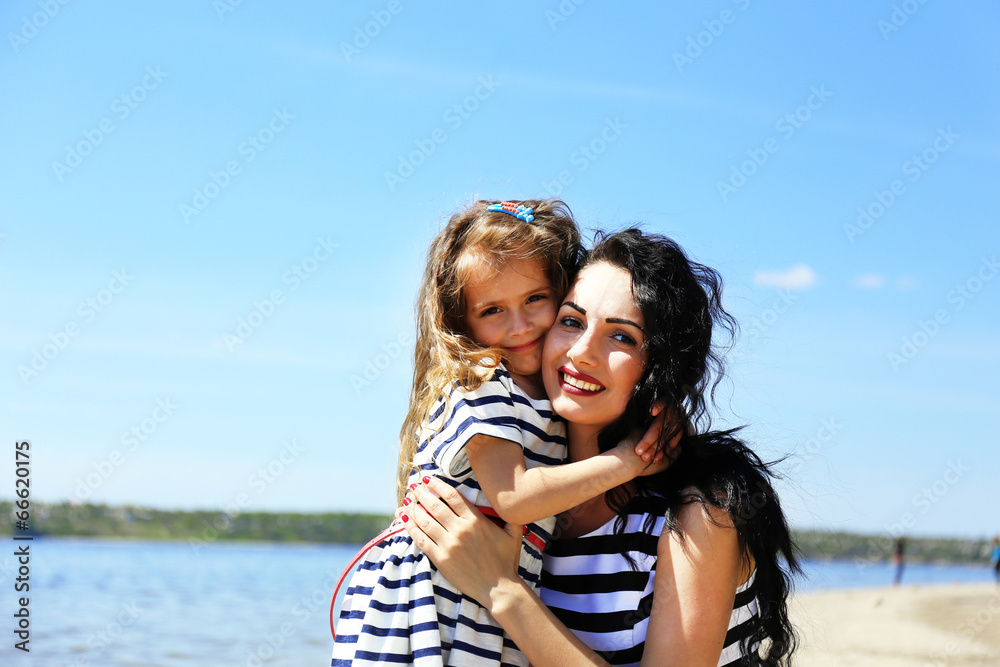 Happy mom and daughter on the beach Happy mom and daughter on the beach