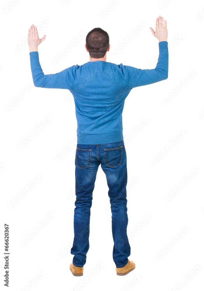 Back view of handsome man in blue pullover looking up. Back view of handsome man in blue pullover looking up.