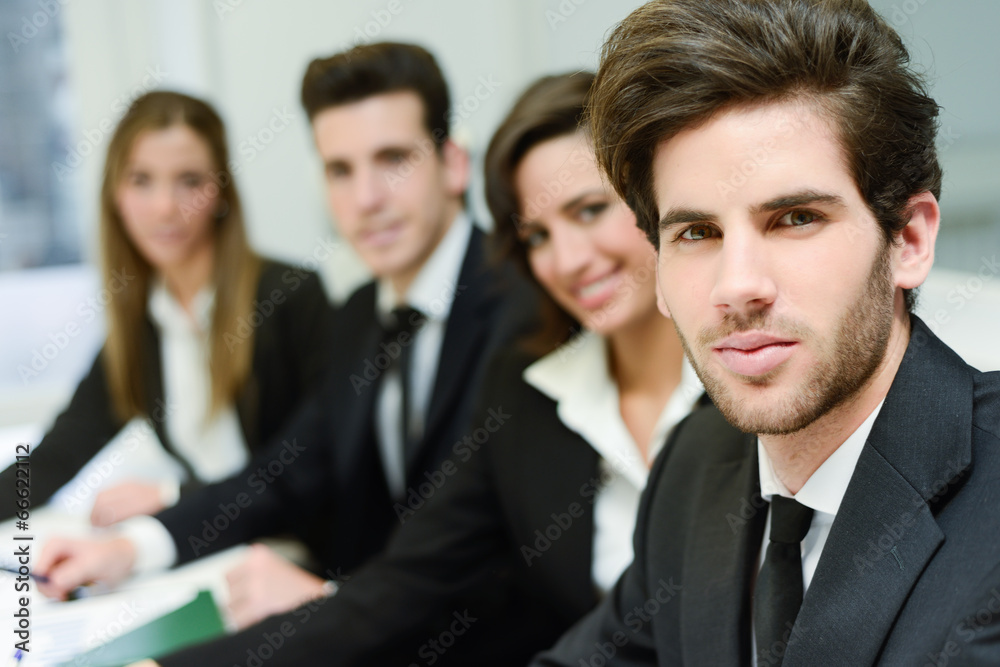 Business leader looking at camera in working environment Business leader looking at camera in working environment