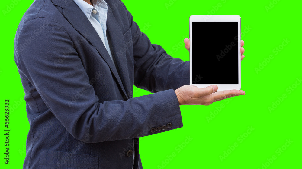 Business man presenting blank screen tablet isolated on green ba Business man presenting blank screen tablet isolated on green ba