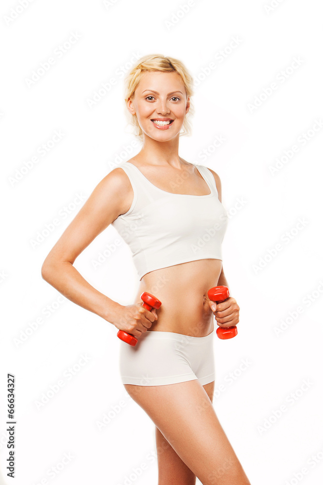 Young woman working out with dumbbells on a white background Young woman working out with dumbbells on a white background