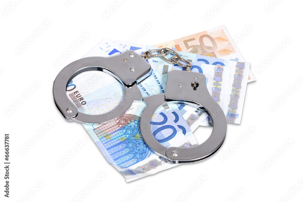 Handcuffs and Euro money isolated over white with clipping path Handcuffs and Euro money isolated over white with clipping path