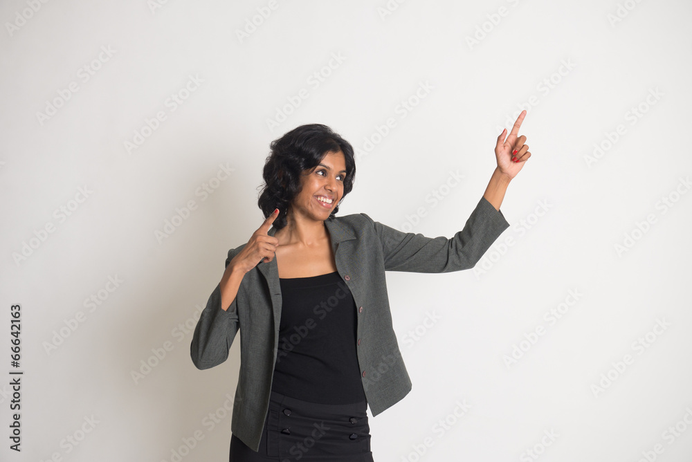 asian business woman celebrating bhangra in joy with plain backg asian business woman celebrating bhangra in joy with plain backg