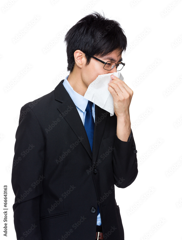 Businessman sneeze