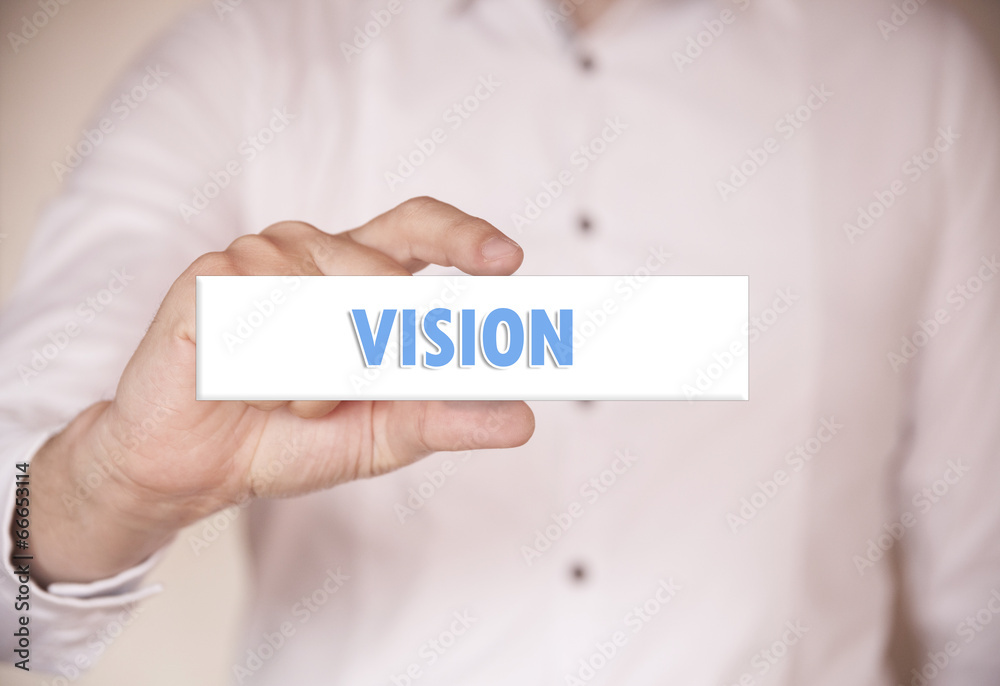 Man holding a word: Vision