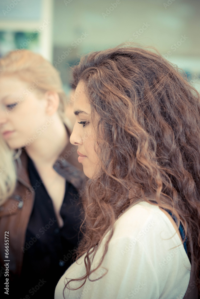 Fototapeta premium blonde and brunette beautiful stylish young women