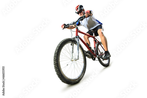 Fototapeta Naklejka Na Ścianę i Meble -  Male cyclist riding a mountain bike