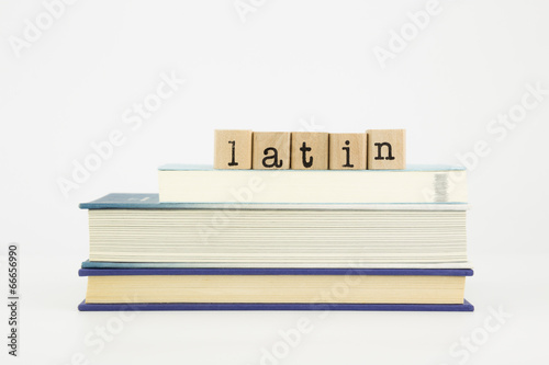 latin language word on wood stamps and books