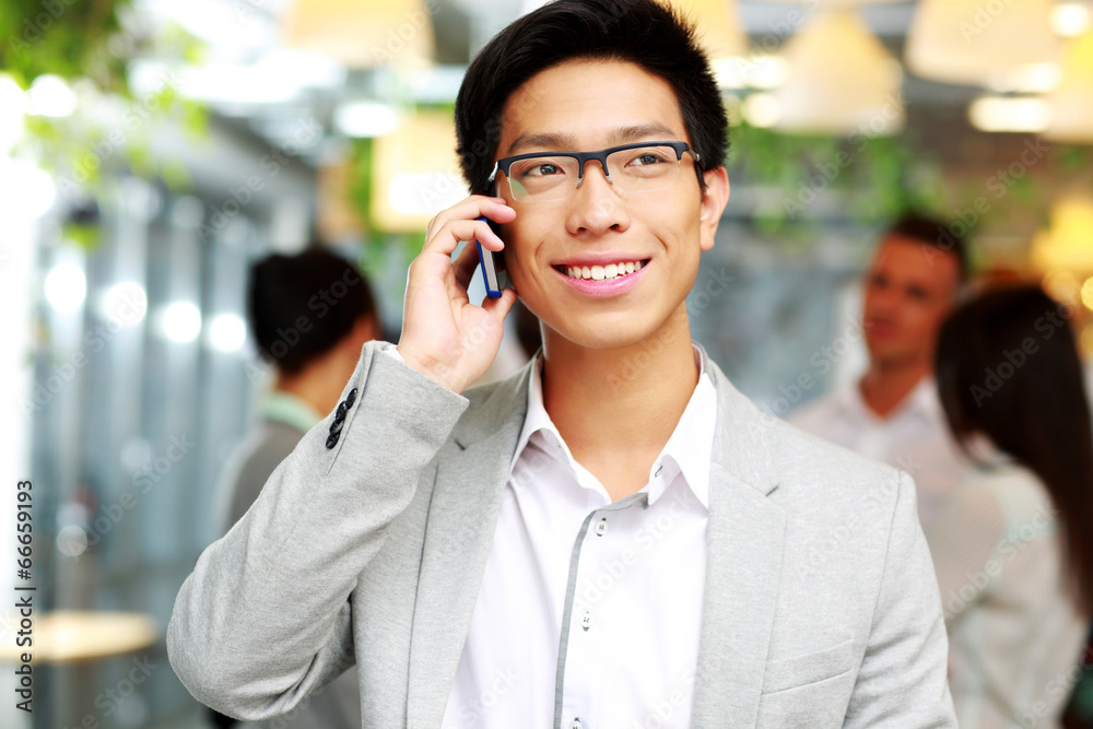 Portrait of a happy businessman talking on the smartphone Portrait of a happy businessman talking on the smartphone