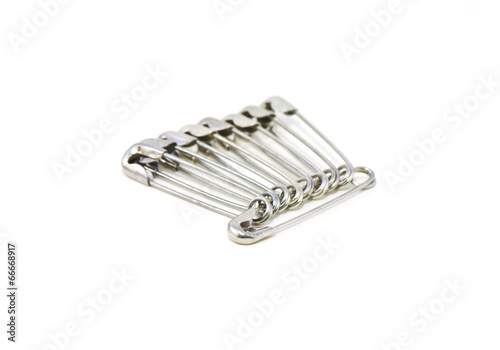 safety pins on white background