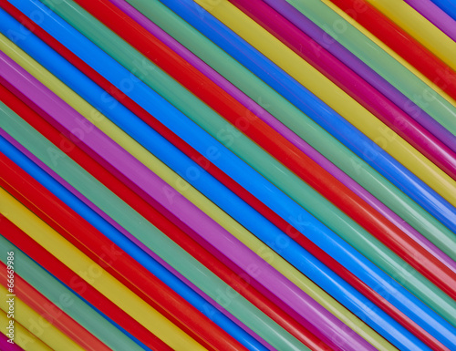 variety of drinking straws, colorful background