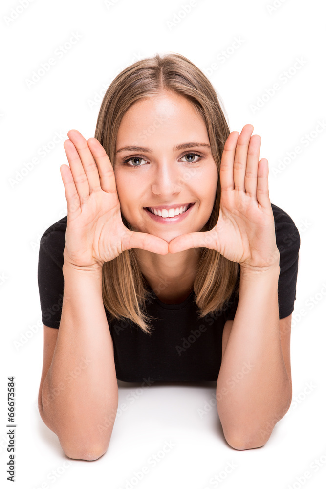 Woman doing a hand frame Woman doing a hand frame
