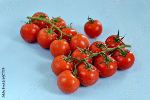 Cherry tomatoes on blue background