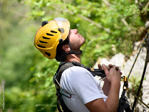 steeplejack climbing a rock wall