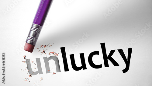 Bild auf Leinwand Eraser changing the word Unlucky for Lucky