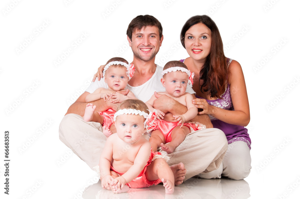 Big happy family with three daughters triplets