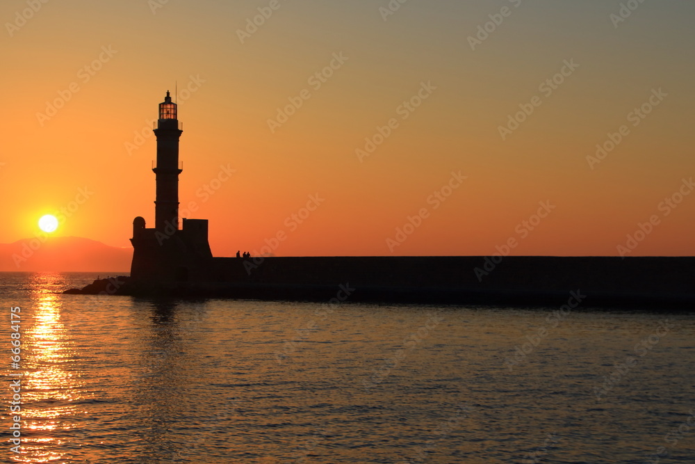 Sunset at harbor with lighthouse Chania Crete