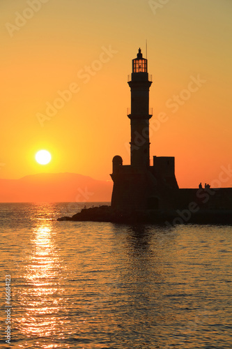 Sunset at harbor with lighthouse Chania Crete