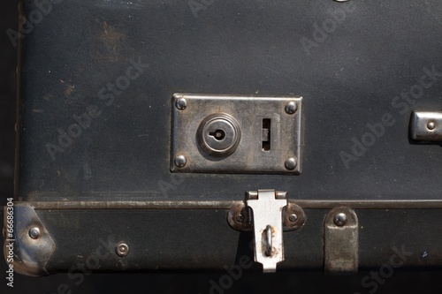 old suitcases with metal clasps brown and black