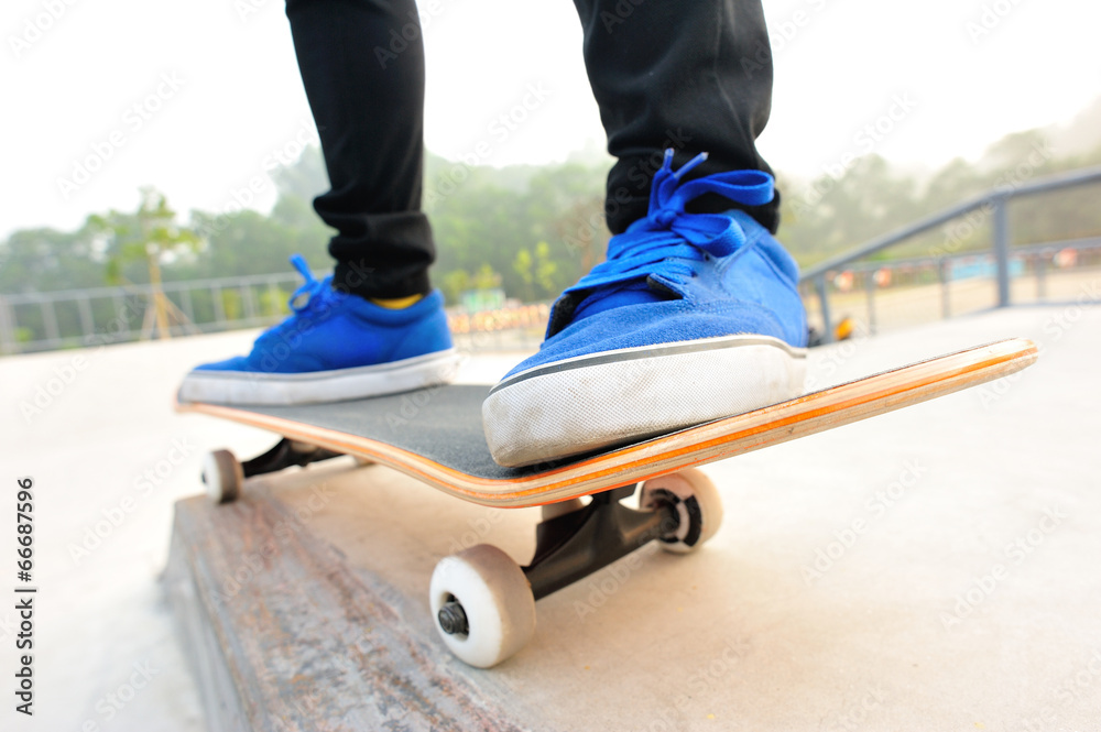 skateboarding woman legs at sunrise skatepark skateboarding woman legs at sunrise skatepark