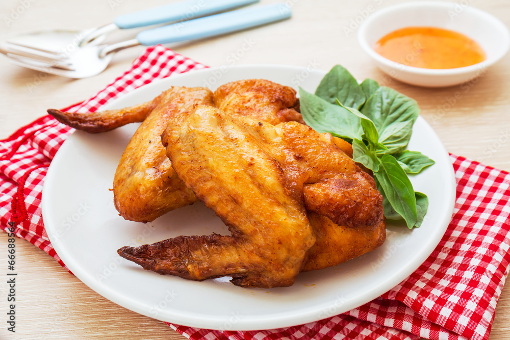 Roasted chicken wings on plate Roasted chicken wings on plate