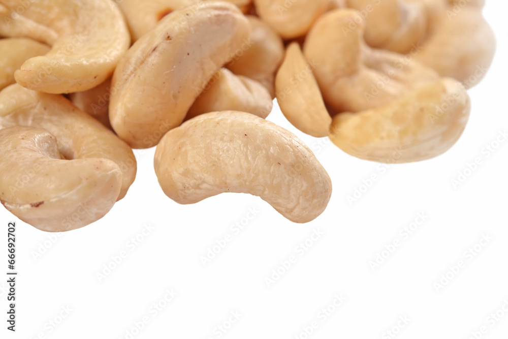 Heap of cashews on a white Heap of cashews on a white