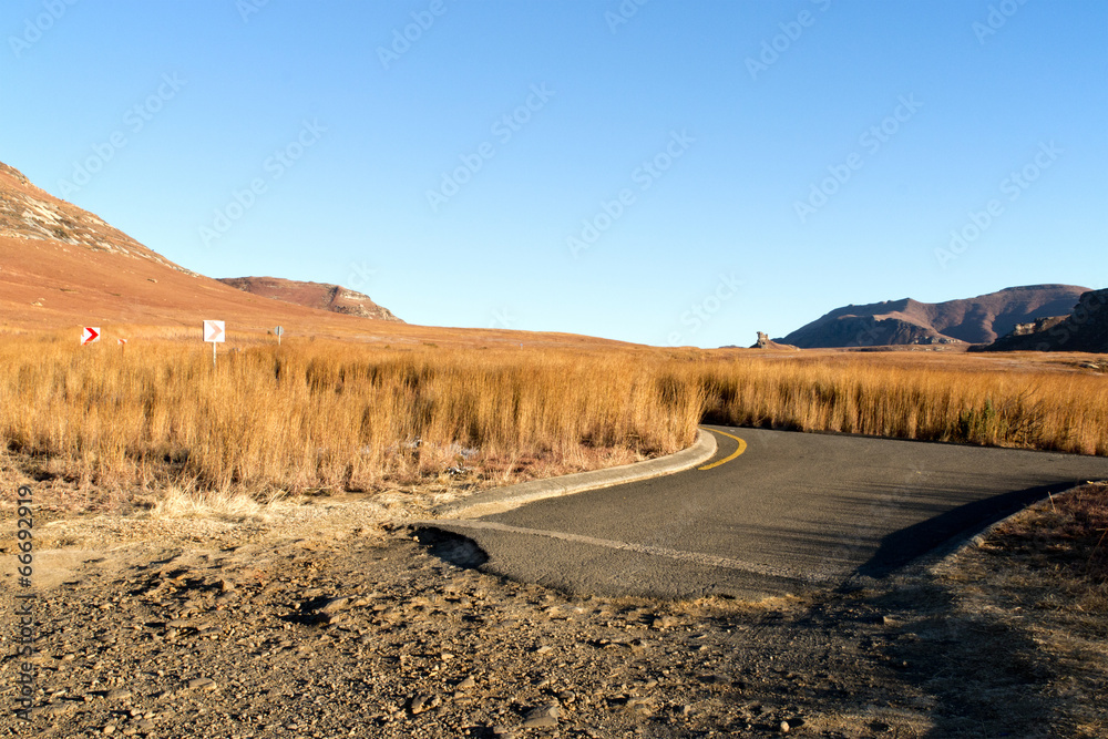 Desolate Rural Road Showing where Asphalt Ends and Dirt Begins