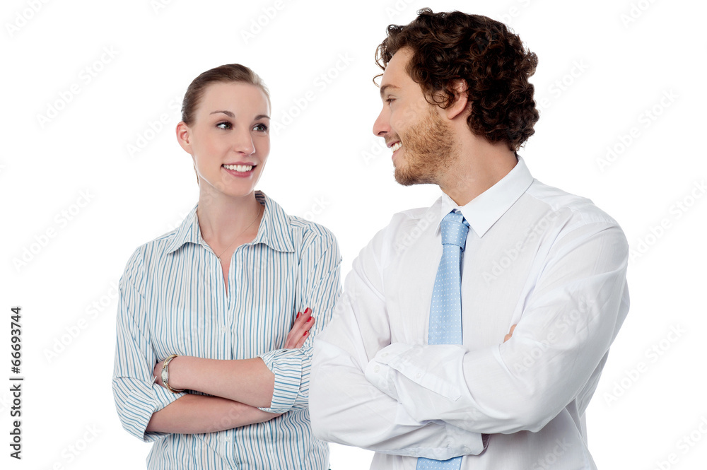 Successful business couple with arms crossed Successful business couple with arms crossed